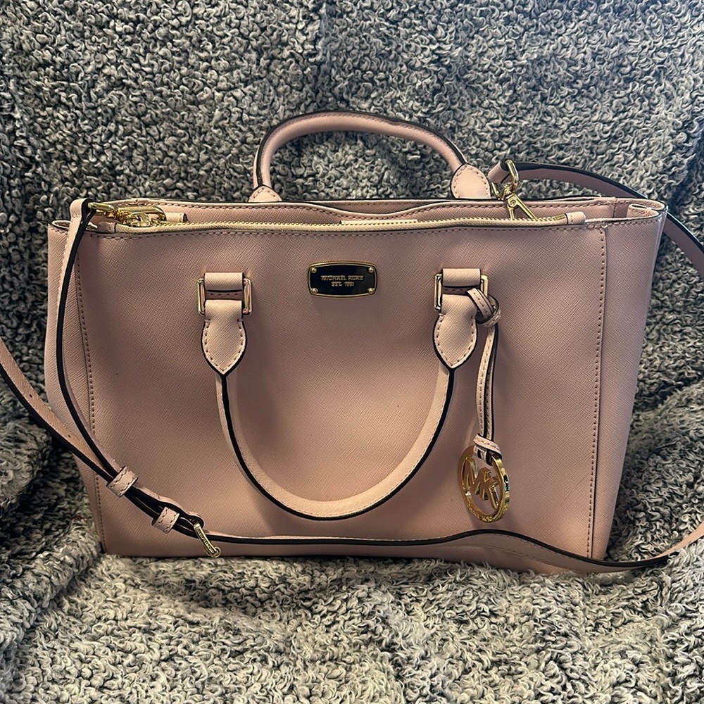 Pink purse with shoulder strap